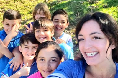 a female young learner teacher and her students